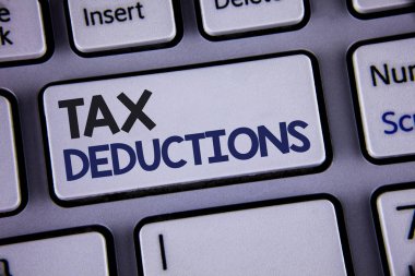 Conceptual hand writing showing Tax Deductions. Business photo showcasing Reduction on taxes Investment Savings Money Returns Text two words backspace button key press grey computer clipart