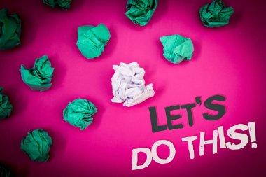 Writing note showing  Let Us Do This Motivational Call. Business photo showcasing Encourage to start something Inspirational Text Words pink background crumbled paper notes stress written angry clipart