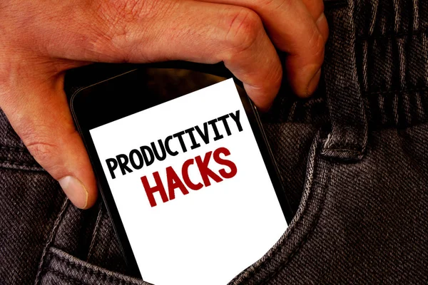 Handwriting text Productivity Hacks. Concept meaning Hacking Solution Method Tips Efficiency Productivity Brown jeans back pocket hand pushing mobile phone with black and red text