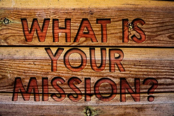 Handwriting text What Is Your Mission Question. Concept meaning Positive goal focusing on achieving success Wooden background vintage wood board wild message ideas intentions thoughts