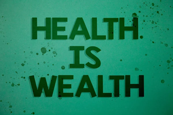 健康は富を示すメモを書きます 良い形の大きな価値健康中展示ビジネス写真食べる健康的なアイデアのメッセージ緑の背景のインスピレーション思い出素敵な思考 — ストック写真