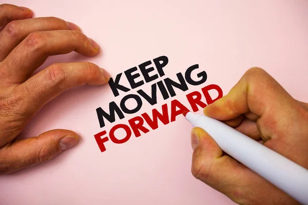 Writing note showing  Keep Moving Forward. Business photo showcasing improvement Career encouraging Go ahead be better Marker pen paper Ideas messages remember information important pink