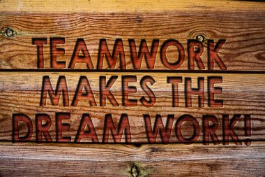 Handwriting text Teamwork Makes The Dream Work Call. Concept meaning Camaraderie helps achieve success Wooden background vintage wood board wild message ideas intentions thoughts clipart