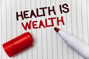 Kavramsal el sağlık zenginlik olduğunu gösteren yazma. İyi durumda büyük değer kalmak sağlıklı olmak vitrine iş fotoğraf yemek sağlıklı beyaz arka plan marker aşk mesajı fikir anılar Tapınağı