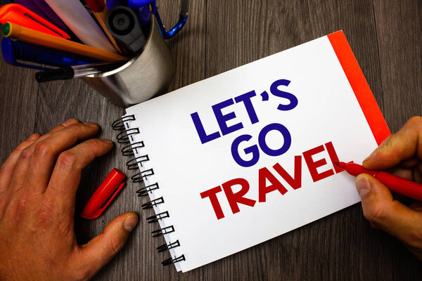 Text sign showing Let'S Go Travel. Conceptual photo Going away Travelling Asking someone to go outside Trip Penholder notepad marker feelings ideas appointments information important