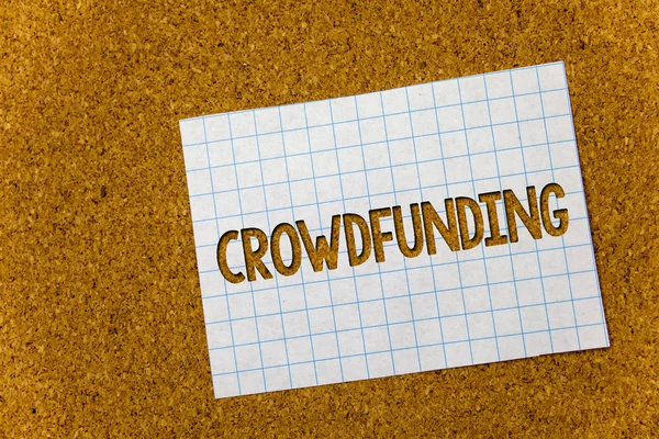 Text sign showing Crowdfunding. Conceptual photo Funding a project by raising money from large number of people Cork background notebook paper ideas messages thoughts to do list remember. — Stock Photo, Image