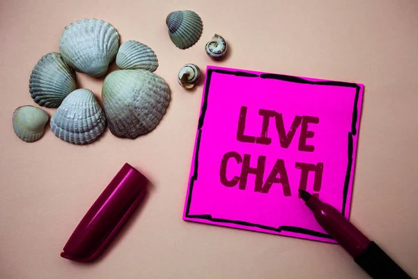 Text sign showing Live Chat Motivational Call. Conceptual photo Real time media conversation Online communicate Ink marker open cap small shells handwrittern notes artwork paper sheet