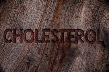 Kolesterol gösterilen Not yazma. Düşük yoğunluklu Lipoprotein yüksek yoğunluklu Lipoprotein şişman kilolu ahşap arka plan vintage ahşap tahta vahşi kaba eski antika mesajları vitrine iş fotoğraf