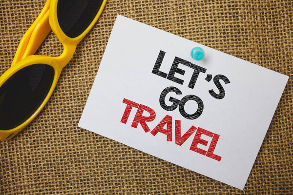Writing note showing Let'S Go Travel. Business photo showcasing Going away Travelling Asking someone to go outside Trip Sunglass paper wonderful white background lovely message idea memories