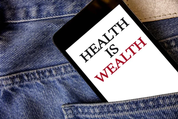 Conceptual hand writing showing Health Is Wealth. Business photo text being in good shape great value Stay healthy eat Healthy Cell phone white screen message application wicker background
