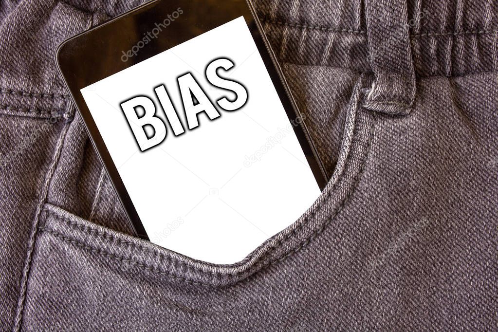Word writing text Bias. Business concept for Unfair Subjective One-sidedness Preconception Inequality Bigotry Cell phone jean pocket white screen message communicate applications