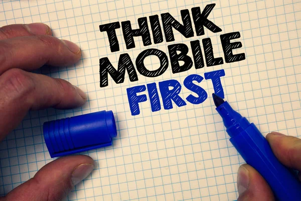 Text sign showing Think Mobile First. Conceptual photo Handheld devises marketing target portable phones first Graph paper grey important thoughts ideas information science math data