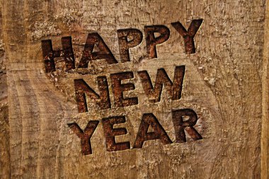 Metin yazma Happy New Year kelime. İş kavramı kutlama neşeli Noel için herkes Ocak başında mesaj afiş ahşap bilgi panosu sonrası kontrplak doğal kahverengi sanat