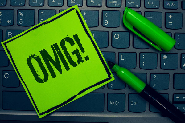 Conceptual hand writing showing Omg Motivational Call. Business photo text Oh my good abbreviation Modern Astonishment expression Keyboard sticky card marker pen office job computer study class