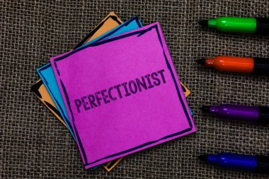 Text sign showing Perfectionist. Conceptual photo Person who wants everything to be perfect Highest standards Multiple colour sticky remember cards pen script marker jute background clipart