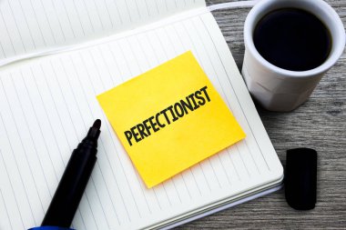 Handwriting text Perfectionist. Concept meaning Person who wants everything to be perfect Highest standards Study material folder card register notebook pen cap tea coffee cup table clipart