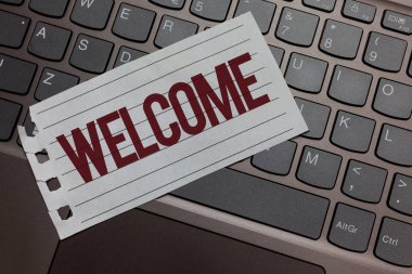 Writing note showing Welcome. Business photo showcasing Warm salutation acknowledgement for someone amiable loved thanked Keyboard colour grey paper keys laptop creative idea computer keypad clipart