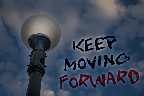 Word writing text Keep Moving Forward. Business concept for improvement Career encouraging Go ahead be better Light post blue cloudy clouds sky ideas message enlighten reflections