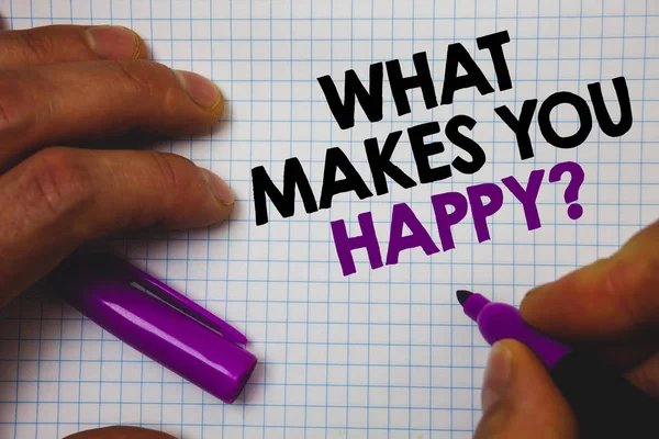 Text sign showing What Makes You Happy Question. Conceptual photo Happiness comes with love and positive life Man hold holding purple marker notebook page messages intentions ideas