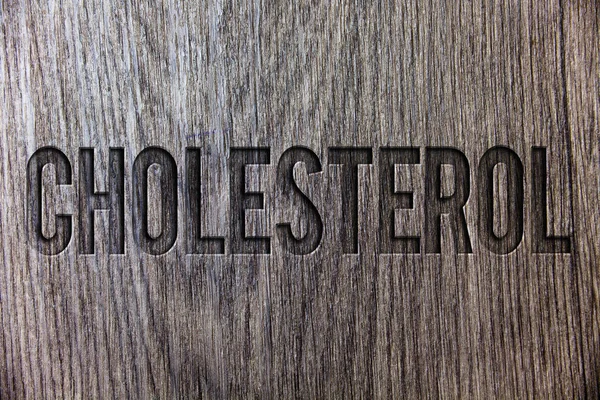 Conceptual hand writing showing Cholesterol. Business photo showcasing Low Density Lipoprotein High Density Lipoprotein Fat Overweight Wooden background vintage wood board message ideas feelings