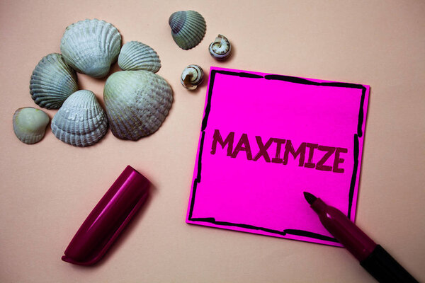 Text sign showing Maximize. Conceptual photo Increase to the greatest possible amount or degree Make larger Ink marker open cap small shells handwrittern notes artwork paper sheet