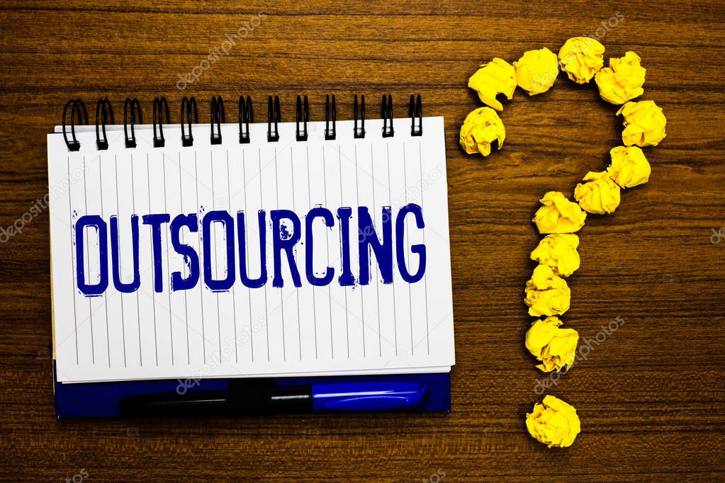 Handwriting text writing Outsourcing. Concept meaning Obtain goods or service by contract from an outside supplier Study notebook register ink pen question mark answer session brown table