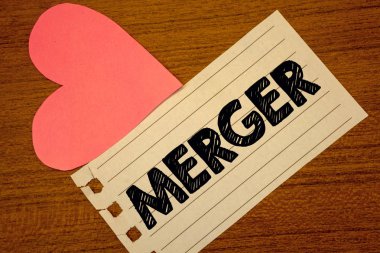 Word metin yazma birleşme. İş kavramı iki şey veya şirketler Fusion koalisyon birleşme Paperpiece sayfa kalp tablo birleşimi için arka plan yazım iş katip çalışması malzeme