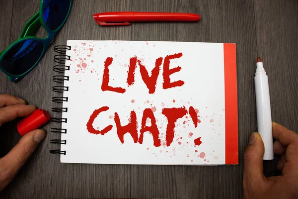 Handwriting text writing Live Chat Motivational Call. Concept meaning Real time media conversation Online communicate Googles glasses pen marker cap notepad notebook highlighter eye sight