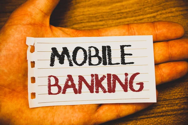 Handwriting text writing Mobile Banking. Concept meaning Online Money Payments and Transactions Virtual Bank Text two Words written white paper note hand open palm pencil message