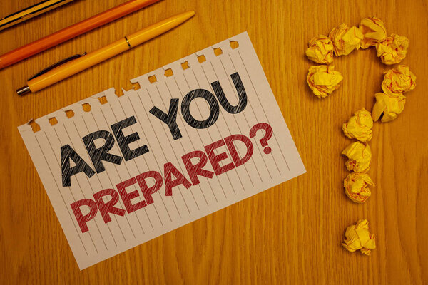 Conceptual hand writing showing Are You Prepared Question. Business photo text Ready Preparedness Readiness Assessment Evaluation Words written Note Desk Pen Pencil Question mark Crumbled paper