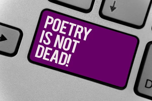 Text sign showing Poetry Is Not Dead. Conceptual photo aesthetic and rhythmic writing is still alive and modern Keyboard key office typing class work click assign button computer program