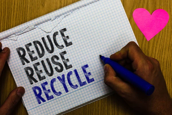 Handwriting text Reduce Reuse Recycle. Concept meaning ways can eliminate waste protect your environment Paper register multiline text pen handwriting love heart table background
