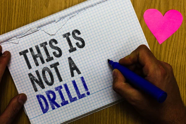 Handwriting text This Is Not A Drill. Concept meaning practice actions Making test false majors Training Paper register multiline text pen handwriting love heart table background