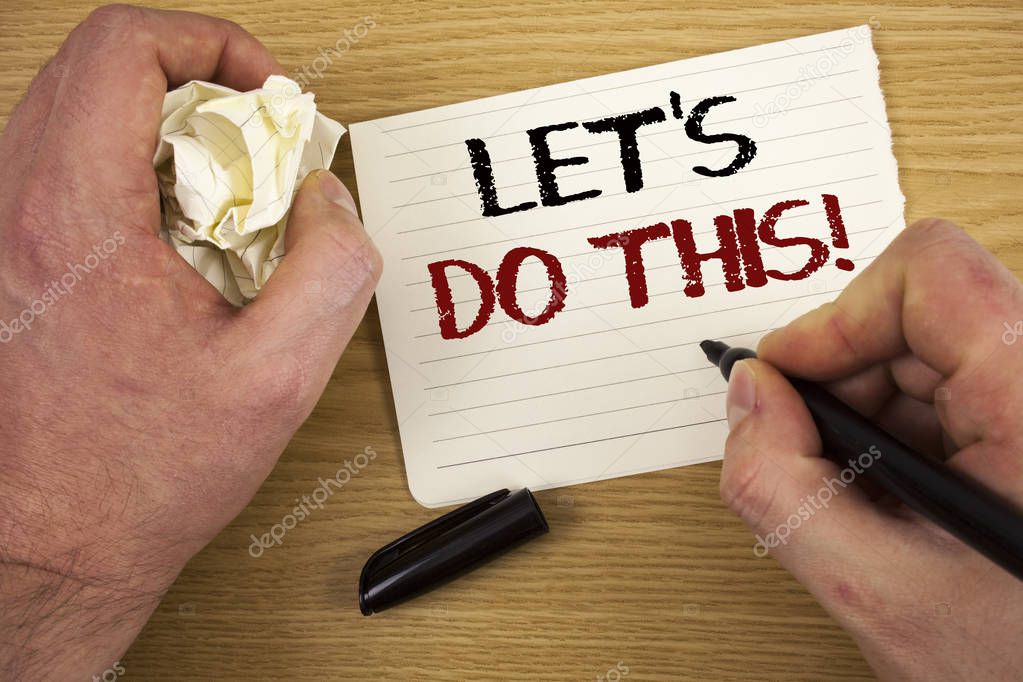 Handwriting text Let Us Do This Motivational Call. Concept meaning Encourage to start something Inspirational Text two words white paper note black marker hand crumbled paper note