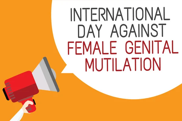 Text sign showing International Day Against Female Genital Mutilation. Conceptual photo awareness day February Man holding megaphone loudspeaker speech bubble message orange background