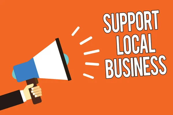 Writing note showing Support Local Business. Business photo showcasing increase investment in your country or town Man holding megaphone loudspeaker orange background message speaking