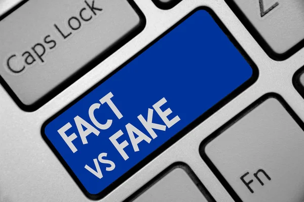 Handwriting text writing Fact Vs Fake. Concept meaning Rivalry or products or information originaly made or imitation Keyboard blue key Intention create computer computing reflection document