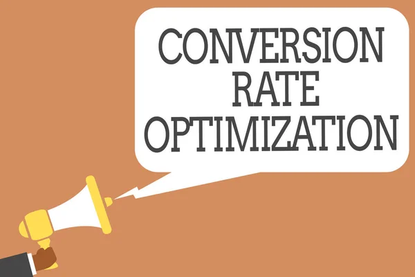 Conceptual hand writing showing Conversion Rate Optimization. Business photo showcasing system for increasing percentage of visitors Man holding megaphone speech bubble message speaking loud