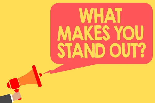 Handwriting text What Makes You Stand Out question. Concept meaning asking someone about his qualities Man holding megaphone loudspeaker speech bubble message speaking loud