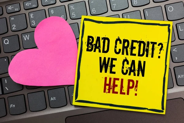 Handwriting text writing Bad Credit question We Can Help. Concept meaning Borrower with high risk Debts Financial Written on black bordered yellow page touched pink heart on computer keyboard