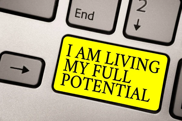 Word writing text I Am Living My Full Potential. Business concept for Embracing opportunities using skills abilities Grey silvery keyboard with bright yellow color button black color texts