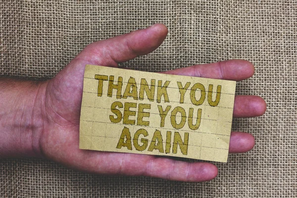 Conceptual hand writing showing Thank You See You Again. Business photo showcasing Appreciation Gratitude Thanks I will be back soon Thick gray paper with words human hands jute sack background