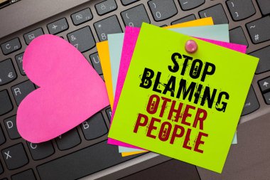 Text sign showing Stop Blaming Other People. Conceptual photo Do not make excuses assume your faults guilt Bright colorful written papers pinch by pin pink heart on computer keyboard clipart