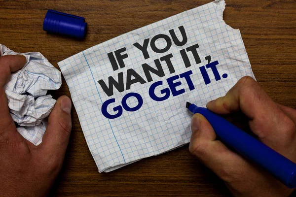 Word writing text If You Want It, Go Get It. Business concept for Make actions to accomplish your goals wishes Hand hold paper lob and blue marker wooden base with torn white written page
