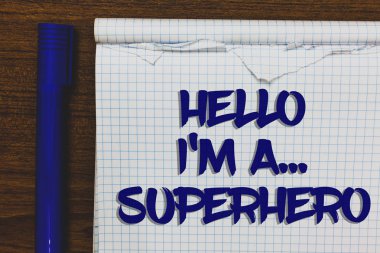 Writing note showing Hello I am A ... Superhero. Business photo showcasing Special powers Cartoon character Customs strenght Written white notepad on grey wooden background beside blue marker clipart