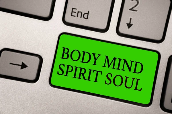 Writing note showing Body Mind Spirit Soul. Business photo showcasing Personal Balance Therapy Conciousness state of mind Silver grey computer keyboard green button with black letters