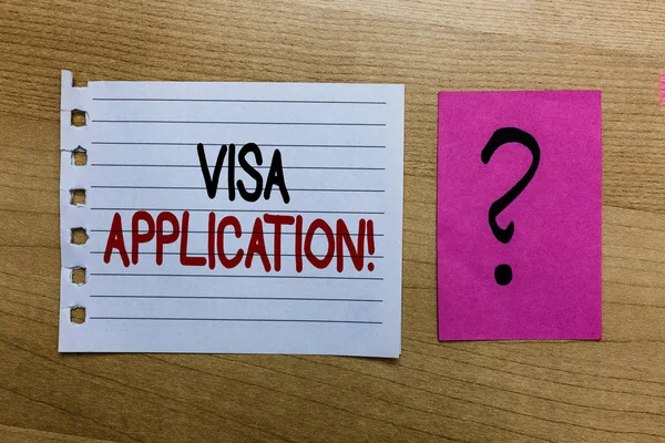 Conceptual hand writing showing Visa Application. Business photo text Form to ask permission travel or live in another country white page on wooden desk with words violet with question mark