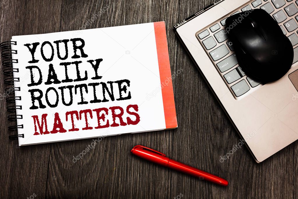 Conceptual hand writing showing Your Daily Routine Matters.. Business photo showcasing Have good habits to live a healthy life Bluetooth mouse on keyboard words red pen on wooden deck