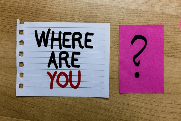 Conceptual hand writing showing Where Are You. Business photo text Give us your location address direction point of reference white page on wooden desk with words violet with question mark