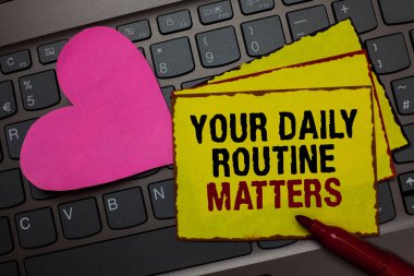 Writing note showing Your Daily Routine Matters.. Business photo showcasing Have good habits to live a healthy life Red bordered yellow written paper pinch with love on computer keybaord clipart